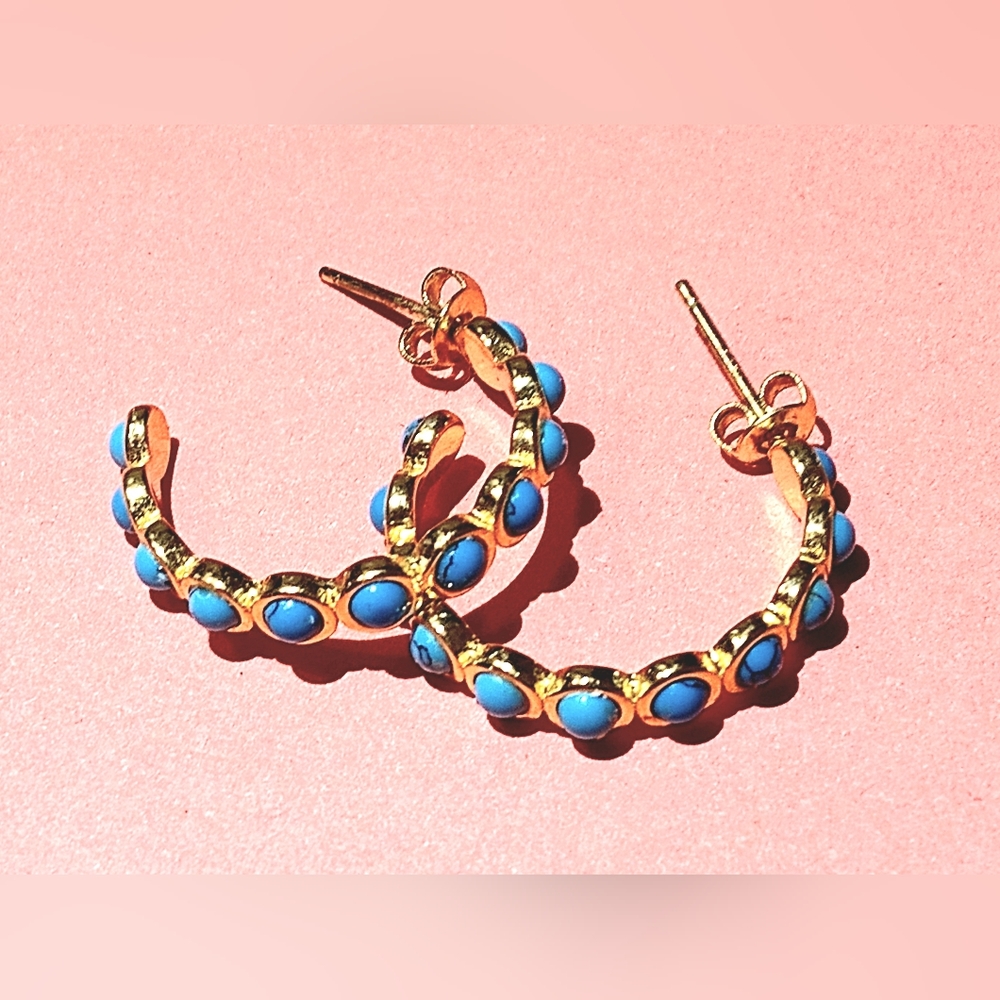 Gold  hoop earrings with turquoise stones throughout